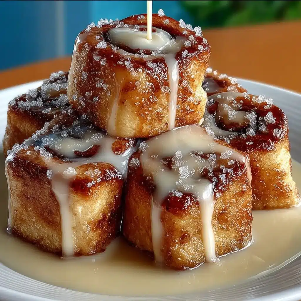 Delicious cinnamon roll French toast bites served on a plate with syrup