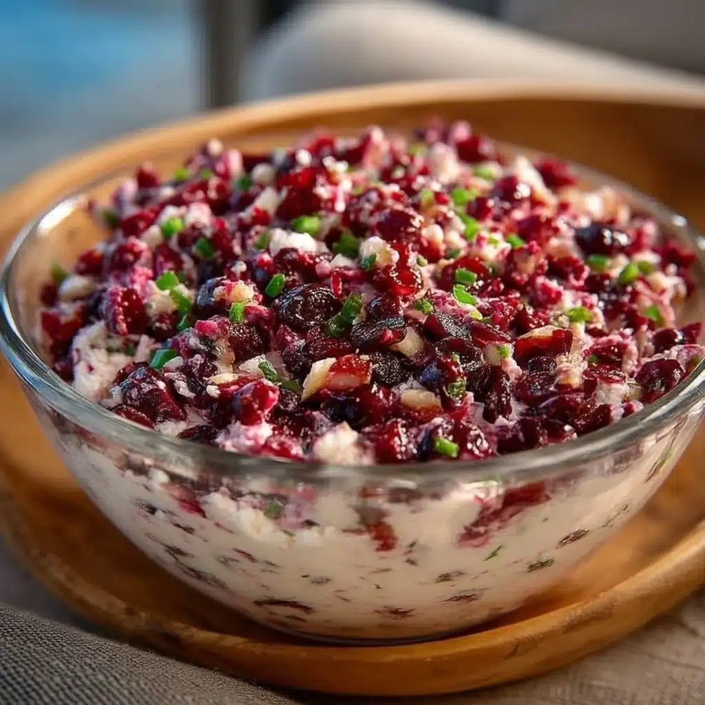 Cranberry Jalapeno Cream Cheese Dip served in a bowl with crackers
